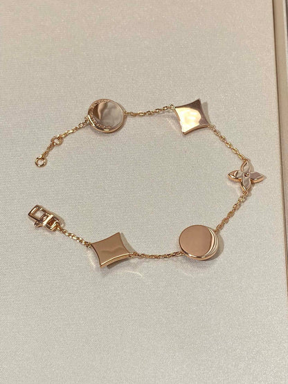 [LUCKY LOVE]STAR AND SUN 5 MOTIF MOP PINK GOLD BRACELET